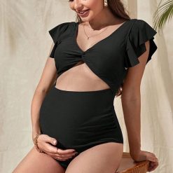 Strój kąpielowy ciążowy z falbanką na plażę i basen Britani. Czarne stroje jednoczęściowe Intica, bez wzorów. Za 149.00 zł.