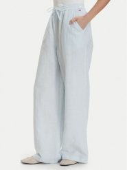 Tommy Jeans Spodnie materiałowe DW0DW22285 Niebieski jasny Loose Fit. Niebieskie spodnie materiałowe Tommy Jeans, bez wzorów, z jeansu. Za 409.99 zł.