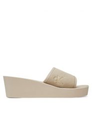 Calvin Klein Jeans Klapki Beach Wedge Slide Canvas YW0YW01725 Beżowy. Brązowe klapki Calvin Klein Jeans, bez wzorów, z jeansu, bez obcasa, bez zapięcia. Za 139.99 zł.