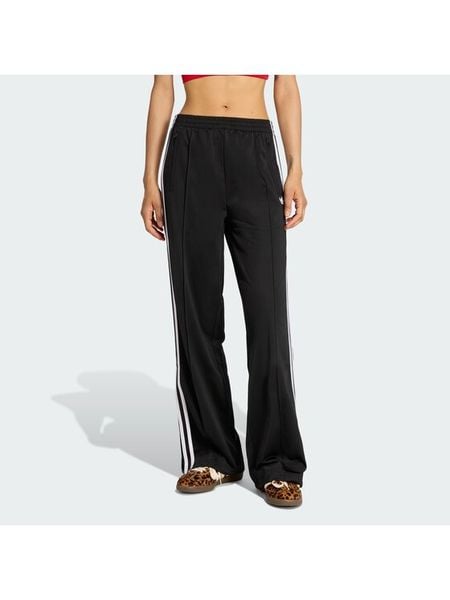 Adidas Spodnie dresowe Firebird KD7976 Czarny Loose Fit. Czarne spodnie dresowe adidas, bez wzorów, z dresówki. Za 299.99 zł.