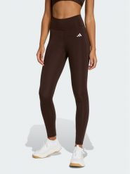 Adidas Legginsy Optimé Essentials Stash JZ0824 Brązowy Slim Fit. Brązowe legginsy adidas, bez wzorów, z syntetyku, sportowe. Za 199.99 zł.
