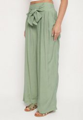 Zielone Szerokie Spodnie z Wiskozy z Wysokim Stanem Kolianne. Zielone jeansy Born2be, l, bez wzorów, z jeansu, eleganckie, z podwyższonym stanem. W wyprzedaży za 76.49 zł.