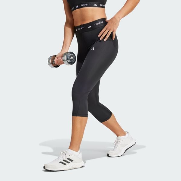 Legginsy capri TECHFIT. Czarne legginsy adidas, bez wzorów, z materiału. Za 179.00 zł.
