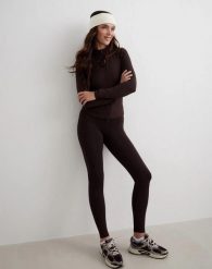 Damskie legginsy ocieplane wydłużone kakaowe. Brązowe legginsy AIM'N, bez wzorów, z dzianiny, długie. Za 350.00 zł.