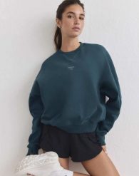 Damska bluza biegowa oddychająca, odprowadzająca wilgoć Le Run lagunowa. Zielone bluzy AIM'N, s, bez wzorów, z bawełny, bez ramiączek, bez kaptura. Za 387.00 zł.