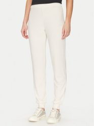 Guess Spodnie materiałowe O5GB05 KCQP2 Granatowy Regular Fit. Niebieskie spodnie materiałowe Guess, z aplikacjami, z materiału. Za 129.99 zł.
