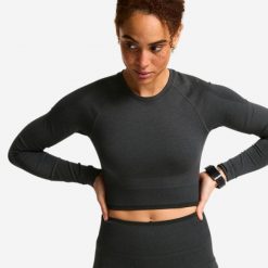 Koszulka do treningu siłowego damska Domyos długi rękaw. Czarne t-shirty sportowe DOMYOS, l, bez wzorów, z dzianiny, bez ramiączek, na fitness i siłownię. Za 59.99 zł.