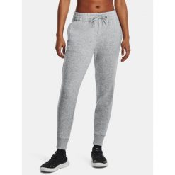 Spodnie Damskie Dresowe Joggery Under Armour Rival Fleece. Szare spodnie sportowe Under Armour, bez wzorów, z dresówki, na fitness i siłownię. Za 269.99 zł.