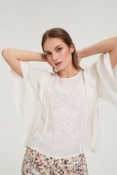 Koszula z falbaną biała. Białe koszule MOODO, l, bez wzorów, z poliesteru, bez kołnierzyka, bez ramiączek. Za 119.99 zł.