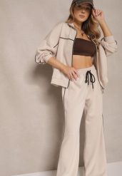Jasnobeżowy Retro Komplet Dresowy z Wiskozą Bluza i Spodnie o Szerokim Kroju Selriza. Brązowe bluzy Renee, z aplikacjami, z dresówki, eleganckie, bez ramiączek, bez kaptura. W wyprzedaży za 151.99 zł.