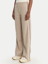 Guess Spodnie dresowe V6GB04 K2955 Beżowy Regular Fit. Brązowe spodnie dresowe Guess, z aplikacjami, z dresówki. Za 519.99 zł.