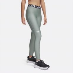 Legginsy treningowe damskie Under Armour HeatGear. Zielone legginsy Under Armour, bez wzorów, sportowe. Za 139.99 zł.