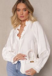 Biała Wiskozowa Koszula Zdobiona Falbankami Hanerina. Białe koszule Renee, l, z aplikacjami, z jeansu, eleganckie, bez kołnierzyka, bez ramiączek. W wyprzedaży za 83.99 zł.