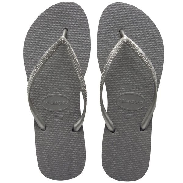 Klapki damskie Havaianas Slim. Szare klapki Havaianas, bez wzorów, z gumy, eleganckie, bez obcasa, bez zapięcia. Za 89.00 zł.