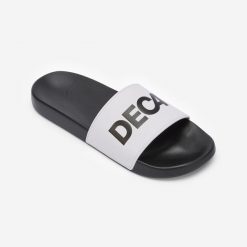 Klapki basenowe Decathlon 500 Collector. Czarne klapki NABAIJI, bez wzorów, z materiału, eleganckie, bez obcasa, bez zapięcia. Za 69.99 zł.