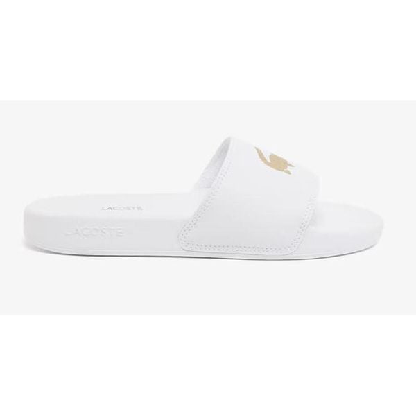 Klapki Sportowe Damskie Lacoste Serve Slide. Białe klapki Lacoste, bez wzorów, z materiału, eleganckie, bez obcasa, bez zapięcia. Za 167.20 zł.