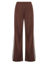 Adidas Spodnie dresowe adicolor Firebird KD2526 Brązowy Loose Fit. Brązowe spodnie dresowe adidas, bez wzorów, z dresówki. Za 223.99 zł.