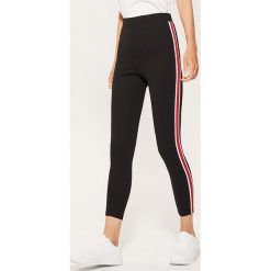 Legginsy z lampasem - Czarny. Legginsy marki DOMYOS. W wyprzedaży za 39.99 zł.