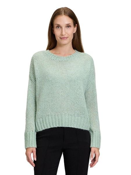 CARTOON Sweter w kolorze zielonym rozmiar: 42. Zielone swetry Cartoon, bez wzorów, z wełny, bez ramiączek. Za 109.52 zł.