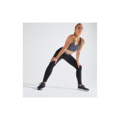 Legginsy fitness kardio damskie 100 czarne. Czarne legginsy DOMYOS, bez wzorów, z elastanu. Za 49.99 zł.