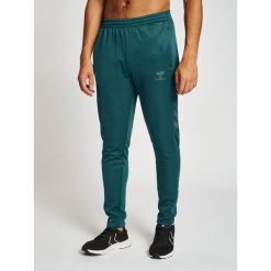 Jogging poliester Hummel Core XK. Zielone spodnie dresowe Hummel, bez wzorów, z dresówki. Za 191.00 zł.