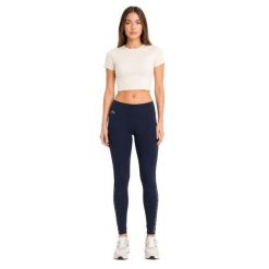Spodnie damskie Lacoste sportowe treningowe legginsy granatowe. Niebieskie legginsy Lacoste, bez wzorów, z elastanu, klasyczne. Za 357.00 zł.