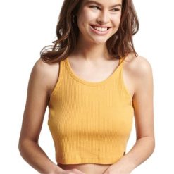 Koszulka sportowa damska Superdry Vintage Crop. Żółte t-shirty sportowe Superdry, bez wzorów, z bawełny, bez ramiączek, na fitness i siłownię. W wyprzedaży za 55.00 zł.