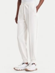 Guess Spodnie dresowe V6BB17 K6344 Kremowy Regular Fit. Białe spodnie dresowe Guess, z aplikacjami, z dresówki. Za 344.99 zł.