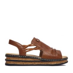 Sandały Rieker. Brązowe sandały Rieker, bez wzorów, bez obcasa, na koturnie, bez zapięcia. Za 299.99 zł.