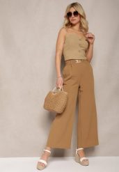 Brązowe Spodnie z Szerokimi Nogawkami w Stylu Palazzo High Waist z Gumką w Pasie z Ozdobnym Elementem Ellsiana. Brązowe jeansy Renee, bez wzorów, z bawełny, eleganckie, z podwyższonym stanem. W wyprzedaży za 35.99 zł.
