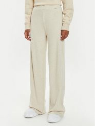 Guess Spodnie dresowe O4BB02 KCHZ2 Beżowy Relaxed Fit. Brązowe spodnie dresowe Guess, z aplikacjami, z bawełny. Za 129.99 zł.