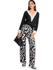 Heine Bluzka w kolorze czarnym rozmiar: 40. Czarne bluzki Heine, bez wzorów, bez kołnierzyka, bez ramiączek. Za 69.91 zł.