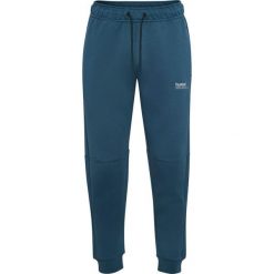 Spodnie dresowe z polaru Hummel Tech Regular. Niebieskie spodnie dresowe Hummel, bez wzorów, z dresówki, sportowe. Za 304.00 zł.