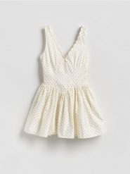 Kombinezon z bawełną - złamana biel. Kombinezony Reserved, bez wzorów, z bawełny, bez kołnierzyka, bez ramiączek. Za 159.99 zł.