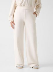 Guess Spodnie materiałowe 180561 Biały Slim Fit. Białe spodnie materiałowe Guess, z aplikacjami, z materiału. Za 295.00 zł.