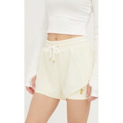 P.E Nation szorty treningowe Reset damskie kolor beżowy gładkie medium waist. Brązowe szorty sportowe P.E Nation, bez wzorów, z dzianiny. W wyprzedaży za 234.99 zł.