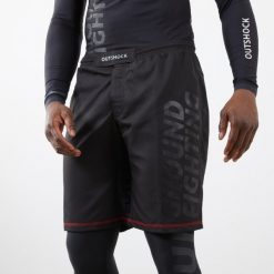 Spodenki do MMA / Grapplingu Outshock Fightshort 500. Czarne szorty OUTSHOCK, bez wzorów, z elastanu, sportowe. Za 129.99 zł.