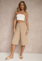 Beżowe Luźne Spodnie 3/4 z Kieszonkami Efrinea. Brązowe jeansy Renee, bez wzorów, z gumy, eleganckie. W wyprzedaży za 31.99 zł.