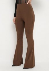 Brązowe Spodnie Dzwony Efrariel. Brązowe jeansy Born2be, l, bez wzorów, z bawełny, eleganckie, z podwyższonym stanem. W wyprzedaży za 63.74 zł.