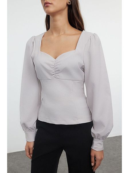 Trendyol Bluzka w kolorze białym rozmiar: 36. Białe bluzki Trendyol, bez wzorów, bez kołnierzyka, bez ramiączek. Za 60.99 zł.