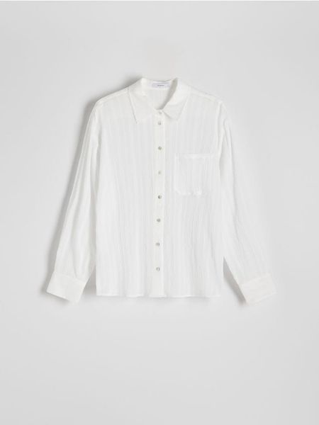 Koszula oversize z bawełny - złamana biel. Koszule Reserved, l, bez wzorów, z bawełny, bez kołnierzyka, bez ramiączek. W wyprzedaży za 39.99 zł.