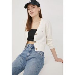 Tommy Jeans kardigan lniany DW0DW13029.PPYY damski kolor beżowy lekki. Brązowe swetry Tommy Jeans, l, bez wzorów, z dzianiny, bez ramiączek. W wyprzedaży za 259.99 zł.