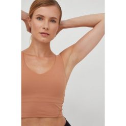 Joy in me top do jogi Grace kolor pomarańczowy. Brązowe topy Joy in me, s, bez wzorów, z materiału, bez kołnierzyka, bez ramiączek. W wyprzedaży za 199.99 zł.