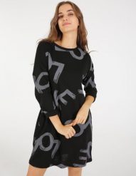 Wzorzysta sukienka. Czarne sukienki Unisono, m, bez wzorów, z tkaniny, bez kołnierzyka, bez ramiączek, mini. Za 119.00 zł.