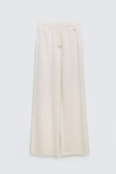 Spodnie damskie dresowe z szeroką nogawką kremowe Lunarap 102. Białe spodnie dresowe BIG STAR, bez wzorów, z dresówki. Za 179.99 zł.