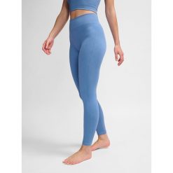 Damskie legginsy bezszwowe Hummel MT Adapt MW. Fioletowe legginsy Hummel, bez wzorów, sportowe. Za 170.00 zł.