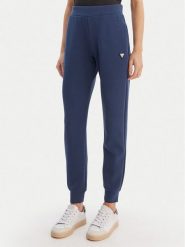Guess Spodnie dresowe V4YB08 KCAY2 Granatowy Regular Fit. Niebieskie spodnie dresowe Guess, z aplikacjami, z dresówki. Za 349.99 zł.