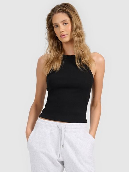 4F Top slim z prążkowanej dzianiny damski - czarny S. Czarne topy 4f, l, bez wzorów, z dzianiny, bez kołnierzyka, bez ramiączek. Za 49.99 zł.