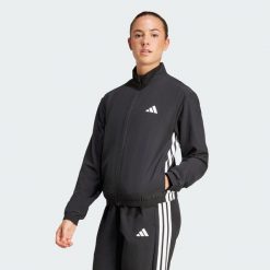 Kurtka Train Essentials 3-Stripes Woven Warm-Up. Czarne kurtki adidas, bez wzorów, casualowe, bez kaptura. Za 186.99 zł.
