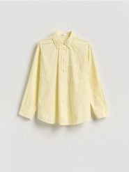 Bawełniana koszula w paski - jasnożółty. Żółte koszule Reserved, l, bez wzorów, z bawełny, bez kołnierzyka, bez ramiączek. Za 109.99 zł.